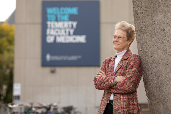 Photo of Dr. Patricia Brubaker in front of the Medical Sciences Building, U of T