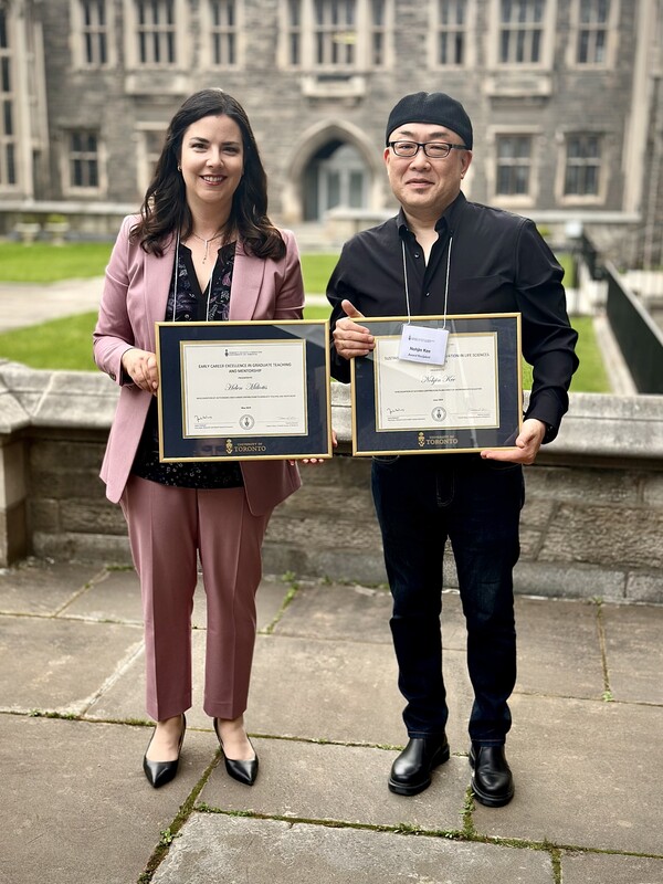 Drs. Nohjin Kee and Helen Miliotis hold their teaching awards.