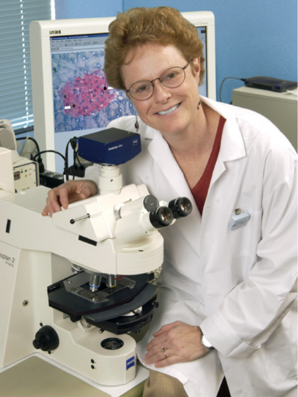 Dr. Patricia Brubaker with her microscope